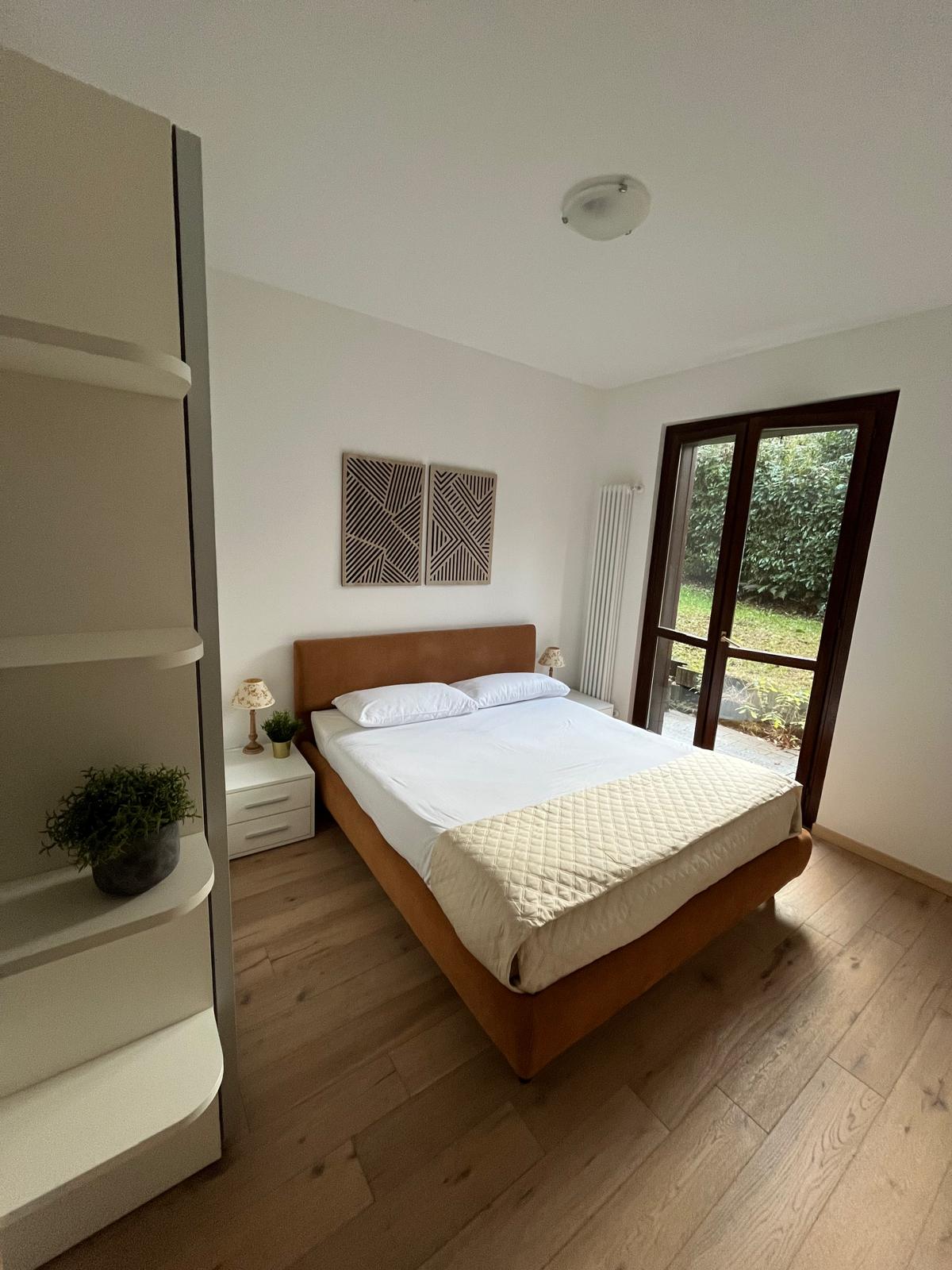 Slaapkamer in het appartement in Argegno